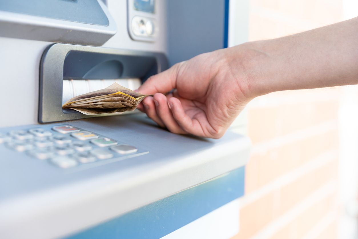 Cash being withdrawn from an ATM